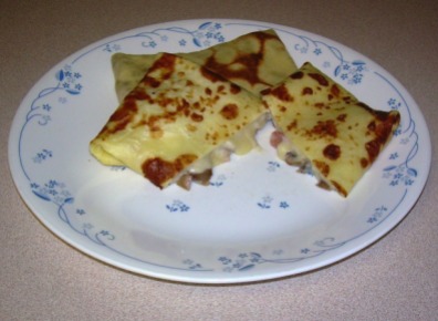 Filled Crepes with Ham and Mushrooms in Bechamel Sauce